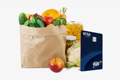 Grocery bag with groceries and the AAA Visa Signature card