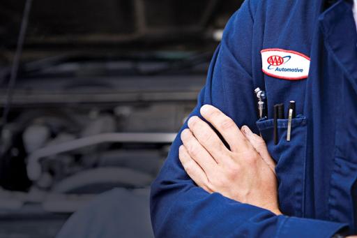 AAA auto repair mechanic with arms crossed